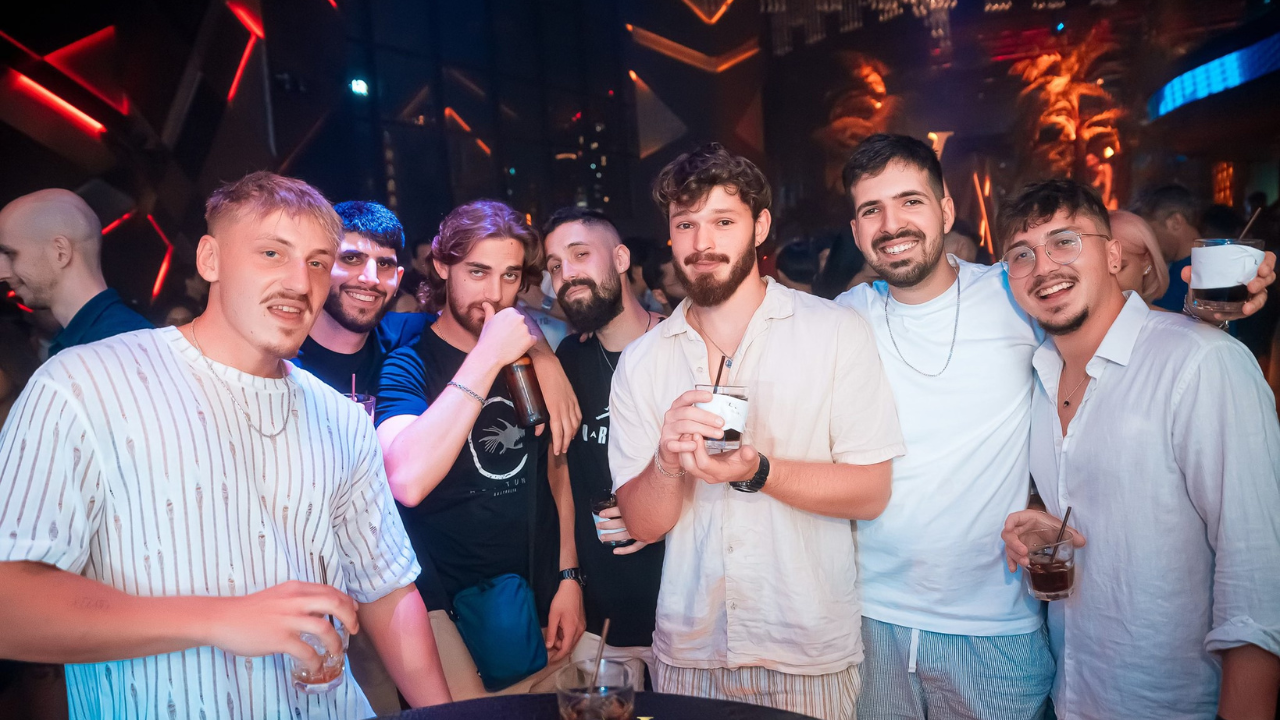 Exclusive Rooftop Bar Bangkok Travelers connecting and chatting at an exclusive rooftop bar in Bangkok